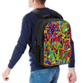Person wearing a colorful backpack with a vibrant leaf pattern on a white background